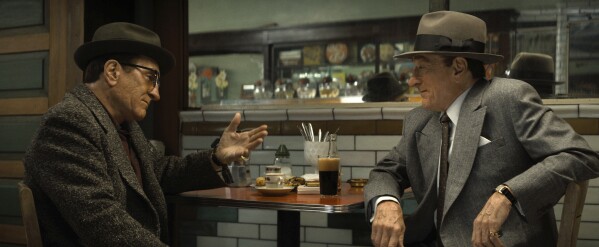 This image released by Warner Bros. Pictures shows Robert De Niro as Vito Genovese, left, and Robert De Niro as Frank Costello in a scene from "The Alto Knights." (Warner Bros. Pictures via AP)