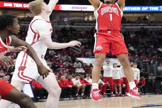 Ohio State's Roddy Gayle Jr. (1) shoots as Wisconsin's Steven Crowl defends during the first half of an NCAA college basketball game at the Big Ten men's tournament, Wednesday, March 8, 2023, in Chicago. (AP Photo/Charles Rex Arbogast)