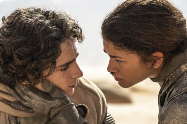 This image released by Warner Bros. Pictures shows Timothee Chalamet, left, and Zendaya in a scene from "Dune: Part Two." (Niko Tavernise/Warner Bros. Pictures via 番茄直播)