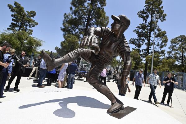 The Los Angeles Dodgers unveil a Sandy Koufax statue in the Centerfield Plaza to honor the Hall of Famer and three-time Cy Young Award winner prior to a baseball game between the Cleveland Guardians and the Dodgers at Dodger Stadium in Los Angeles, Saturday, June 18, 2022. (Keith Birmingham/The Orange County Register via AP)