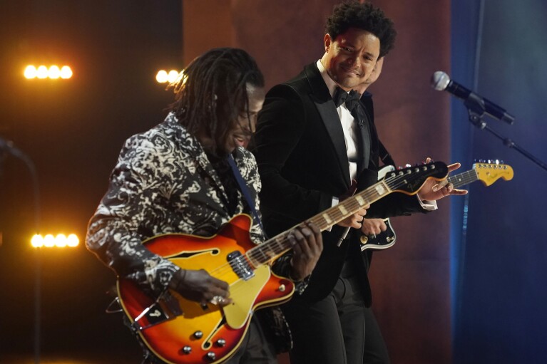 FILE - Host Trevor Noah, right, joins Eric Burton of Black Pumas onstage at the 63rd Grammy Awards at the Los Angeles Convention Center, Thursday, March 11, 2021. Noah will host the 2024 Grammy Awards on Sunday. (AP Photo/Chris Pizzello, File