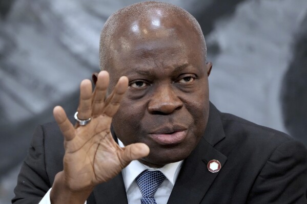 FILE - Gilbert Houngbo, Director General of the International Labour Organization (ILO), addresses the media during a press conference in Berlin, Germany, Tuesday, Nov. 29, 2022. Illegal profits from forced labor worldwide have risen to the “obscene” amount of $236 billion per year, the U.N. labor agency reported Tuesday, March 19, 2024, with sexual exploitation to blame for three-fourths of the take from a business that deprives migrants of money they can send home, swipes jobs from legal workers, and allows the criminals behind it to dodge taxe (AP Photo/Michael Sohn, File)