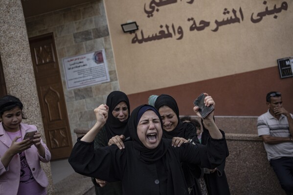 Palestinians mourn their relatives killed in the Israeli bombardment of the Gaza Strip, in the hospital in Khan Younis, Saturday, Nov. 11, 2023. ( AP Photo/Fatima Shbair)