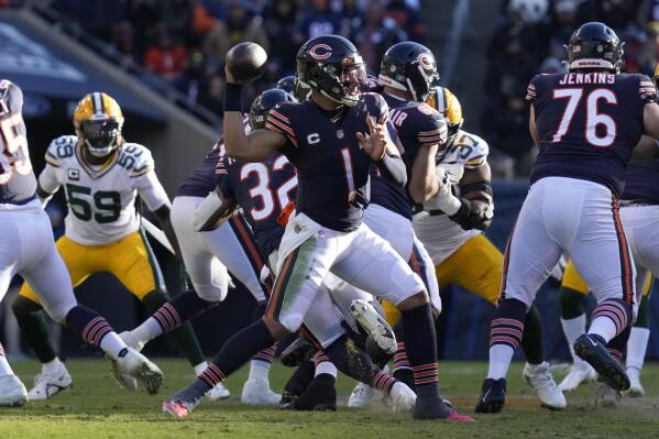 Chicago Bears' Justin Fields thorws during the second half of an NFL football game against the Green Bay Packers Sunday, Dec. 4, 2022, in Chicago. (AP Photo/Nam Y. Huh)