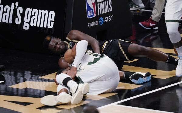 Milwaukee Bucks forward Giannis Antetokounmpo, left, and Atlanta Hawks center Clint Capela fall to the court during the second half of Game 4 of the NBA basketball Eastern Conference finals Tuesday, June 29, 2021, in Atlanta. (AP Photo/Brynn Anderson)