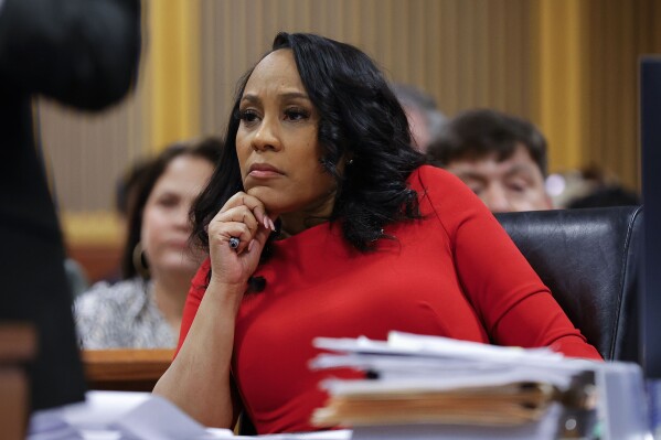FILE - Fulton County District Attorney Fani Willis looks on during a hearing on the Georgia election interference case, March, 1, 2024, in Atlanta. A Georgia appeals court has agreed to review a lower court ruling allowing Fani Willis to continue to prosecute the election interference case she brought against Donald Trump. (AP Photo/Alex Slitz, Pool)