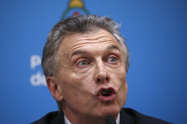 Argentine President Mauricio Macri, who is running for reelection, gives a press conference the day after primary elections at the government house in Buenos Aires, Argentina, Monday, Aug. 12, 2019. Macri was snubbed by voters who appeared to hand a resounding primary victory to a populist ticket with his predecessor, Cristina Fernández. (AP Photo/Natacha Pisarenko)