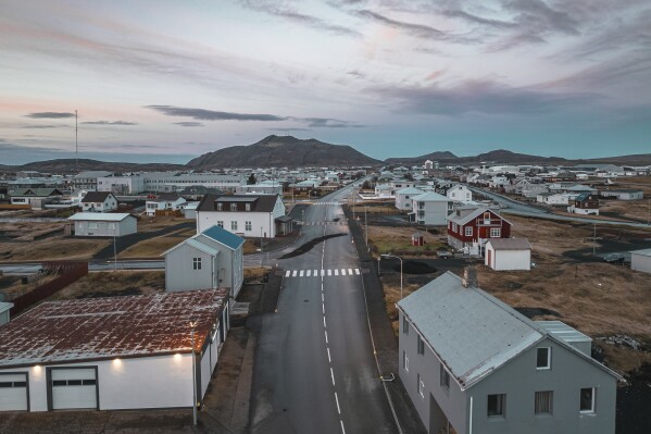 This image taken with a drone shows the town of Grindavik, Iceland, Thursday, Nov. 16, 2023. Residents of a fishing town in southwestern Iceland have left their homes after increasing concern about a potential volcanic eruption caused civil defense authorities to declare a state of emergency in the region. Iceland's Meteorological Office says police decided to evacuate Grindavik after recent seismic activity in the area moved south toward the town. (AP Photo/Bjorn Steinbekk)