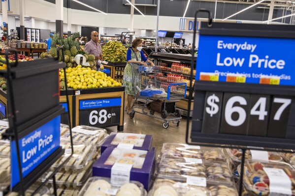 FILE - People buy groceries at a Walmart Superstore in Secaucus, New Jersey, July 11, 2024. (AP Photo/Eduardo Munoz Alvarez)