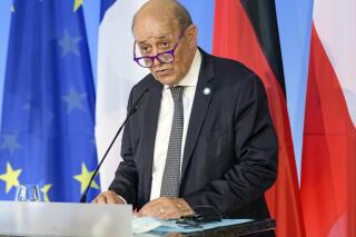 FILE - In this Friday, Sept. 10, 2021 file photo, French Foreign Minister Jean-Yves Le Drian speaks in Weimar, Germany. France said late Friday, Sept. 17 it was immediately recalling its ambassadors to the U.S. and Australia after Australia scrapped a big French conventional submarine purchase in favor of nuclear subs built with U.S. technology. Foreign Minister Jean-Yves Le Drian said in a written statement that the French decision, on request from President Emmanuel Macron, “is justified by the exceptional seriousness of the announcements” made by Australia and the United States.(Jens Schlueter/Pool Photo via AP, file)
