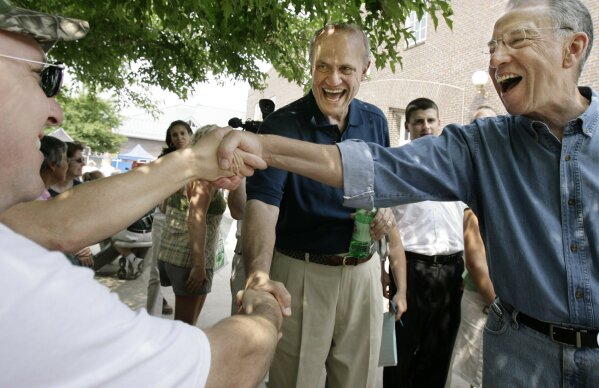 FILE - In this Aug. 17, 2007, file photo, Republican presidential candidate former Sen. Fred Thompson R-Tenn., and Sen. Charles Grassley R-Iowa., shake hands at the Iowa State Fair in Des Moines, I...