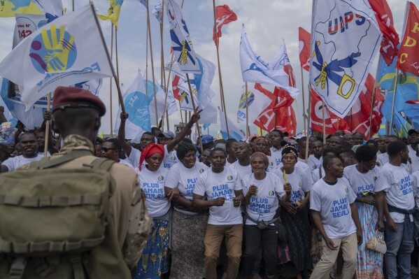 Supporters wait for the arrival of Democratic Republic of the Congo President Felix Tshisekedi at a rally in Goma, Eastern Congo, Sunday, Dec. 10, 2023. Tshisekedi is seeking reelection in the Dec. 20 elections. (AP Photo/Moses Sawasawa)