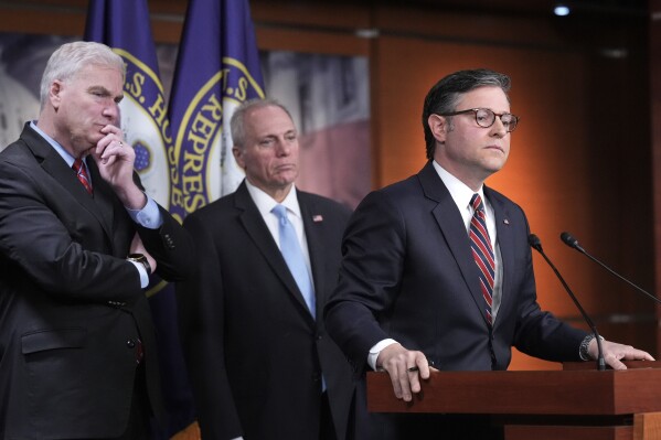 Speaker of the House Mike Johnson, R-La., joined from left by House Majority Whip Tom Emmer, R-Minn., and House Majority Leader Steve Scalise, R-La., talks to reporters at the Capitol in Washington, April 8, 2025. (AP Photo/J. Scott Applewhite, File)