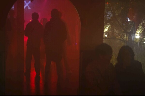 Rave attendees dance to electronic music in Changchun in northeastern China's Jilin province on Oct. 12, 2024. (AP Photo/Dake Kang)