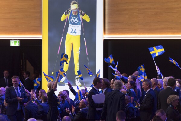 FILE - Stockholm-Are delegation members celebrate during the presentation final presentation of the Stockholm-Are candidate cities the first day of the 134th Session of the International Olympic Committee (IOC), at the SwissTech Convention Centre, in Lausanne, on June 24, 2019. Stockholm’s city council has publicly supported Sweden’s latest bid to get the 2030 Olympics ahead of key meetings Tuesday for potential Winter Games hosts. (Laurent Gillieron/Keystone via AP, File)