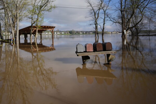 The rising Ohio River floods along Lower River Road, Monday, April 7, 2025, in Rabbit Hash, Ky. (AP Photo/Carolyn Kaster)
