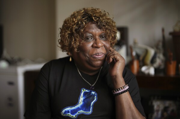 Chagossian Bernadette Dugasse pauses, during an interview with The Associated Press, at her home in London, Tuesday, March 25, 2025. (AP Photo/Kin Cheung)