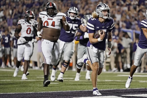 Kansas State quarterback Avery Johnson (5) runs for a touchdown during the second half of an NCAA college football game against Southeast Missouri State Saturday, Sept. 2, 2023, in Manhattan, Kan. (AP Photo/Charlie Riedel)