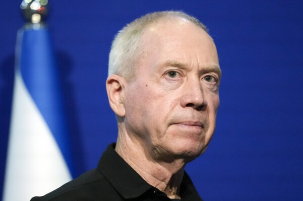 FILE - Israeli Defense Minister Yoav Gallant pauses while making a brief statement to the media at The Kirya, Israel's Ministry of Defense, on Oct. 16, 2023, in Tel Aviv. Top Israeli officials are accused of seven war crimes and crimes against humanity by the ICC. (AP Photo/Jacquelyn Martin, Pool, File)