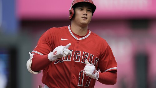 Los Angeles Angels' Shohei Ohtani, from Japan, celebrates as he runs the bases after hitting a solo home run during the seventh inning of a baseball game against the Kansas City Royals Saturday, June 17, 2023, in Kansas City, Mo. (AP Photo/Charlie Riedel)