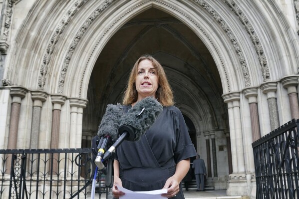 Tessa Gregory from Leigh Day solicitors who represent Afghan families affected by alleged illegal activity by British special forces in the war-torn nation between 2010 and 2013, makes a a statement outside the Royal Courts of Justice, in London, Monday, Oct. 9, 2023. An independent inquiry has opened in the U.K. to examine claims that British special forces murdered dozens of Afghan men during counterinsurgency operations in Afghanistan a decade ago. It will also look into allegations that authorities subsequently covered up the alleged illegal activity. (Jonathan Brady/PA Wire/PA via AP)