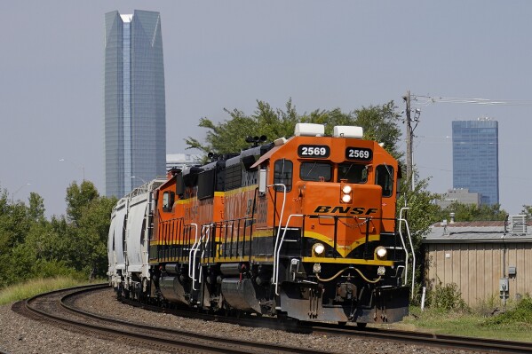 FILE - A BNSF locomotive heads south out of Oklahoma City, Sept. 14, 2022. BNSF will become the second major freight railroad to allow some of its employees to report safety concerns anonymously through a federal system without fear of discipline, the Federal Railroad Administration announced Thursday, April 25, 2024. (AP Photo/Sue Ogrocki, File)
