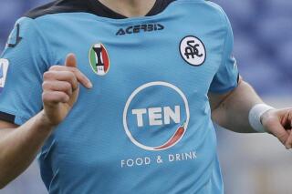 FILE - In this file photo dated Saturday, Jan. 23, 2021, A Spezia soccer team shirt during the Italian Series A match against Roma at the Rome Olympic Stadium. American-owned Italian club Spezia has been hit with a two-year transfer ban by FIFA, in a case relating to the Serie A club breaking transfer rules when it recruited youngsters from Africa.(AP Photo/Gregorio Borgia, FILE)