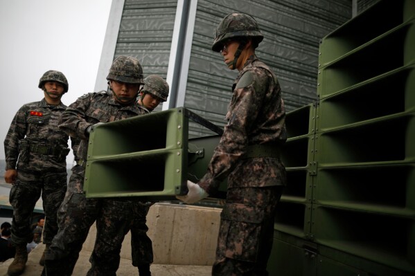 FILE - South Korean soldiers dismantle loudspeakers that set up for propaganda broadcasts near the demilitarized zone separating the two Koreas in Paju, South Korea, on May 1, 2018. South Korea announced Sunday, June 9, 2024 it would resume anti-North Korean propaganda loudspeaker broadcasts in border areas in retaliation to the North sending over 1,000 balloons filled with trash and manure over the last couple of weeks. (Kim Hong-Ji/Pool Photo via AP, File)