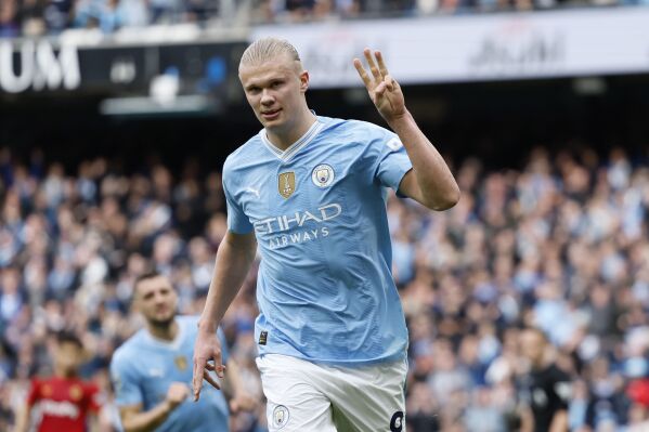 Manchester City's Erling Haaland celebrates scoring their third goal of the game during the English Premier League soccer match between Manchester City and Wolverhampton Wanderers at the Etihad Stadium in Manchester, England, Saturday, May 4, 2024. (Richard Sellers/PA via AP)