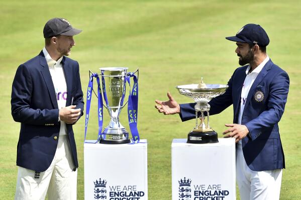 England captain Joe Root, left, and India captain Virat Kohli meet with the trophies prior to the first Test Match between England and India at Trent Bridge cricket ground in Nottingham, England, Monday, Aug. 2, 2021. (AP Photo/Rui Vieira)