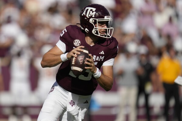 Texas A&M quarterback Conner Weigman (15) looks to pass against Louisiana-Monroe during the second quarter of an NCAA college football game Saturday, Sept. 16, 2023, in College Station, Texas. (AP Photo/Sam Craft)
