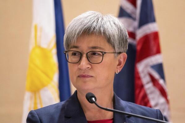 FILE - Australian Foreign Minister Penny Wong listens beside Philippine Foreign Affairs Secretary Enrique Manalo during a joint press conference at a hotel in Makati City, Philippines on Thursday May 18, 2023. An 88-year-old Australian doctor held captive in West Africa for more than seven years has been released, the Australian government said on Friday, May 19.(Lisa Marie David/Pool Photo via AP, File)