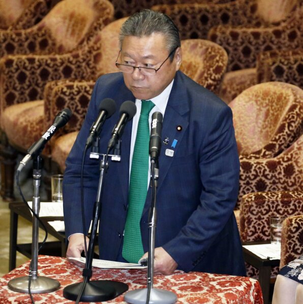 
              In Nov. 14, 2018, photo, ruling Liberal Democratic Party of Japan lawmaker Yoshitaka Sakurada, also in charge of the 2020 Tokyo Olympics, replies to question from independent and opposition legislators at a parliamentary session in Tokyo. Sakurada, Japan’s minister in charge of cybersecurity is in the spotlight for acknowledging he had never used a computer and making comments showing he had no idea what a USB port might be. (Kyodo News via AP)
            