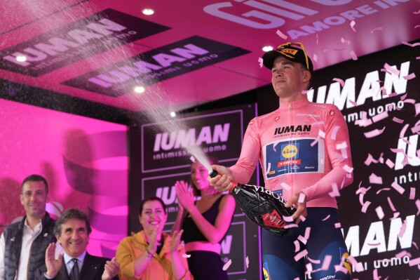 Mads Pedersen of Lidl-Trek, right, celebrates winning stage 1 of the Giro d'Italia from Durazzo (Durres) to Tirana (Tirane), Albania, Friday, May 9, 2025. (Massimo Paolone/LaPresse via AP)