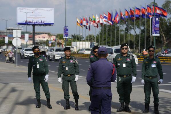 Police officers pose for a souvenir in a group photo as they guard near the Phnom Penh International Airport for the upcoming Association of Southeast Asian Nations (ASEAN) summits in Phnom Penh, Cambodia, Tuesday, Nov. 8, 2022. Southeast Asian leaders convene in the Cambodian capital Thursday, faced with the challenge of trying to curtail escalating violence in Myanmar while the country’s military-led government shows no signs of complying with the group’s peace plan. (AP Photo/Heng Sinith)