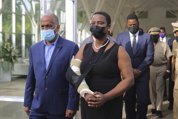 FILE - First Lady Martine Moise arrives for a tribute for her late husband President Jovenel Moise at the National Pantheon Museum in Port-au-Prince, Haiti, July 21, 2021. A Haitian judge investigating the July 2021 assassination of Moise issued an arrest warrant for his wife late last year to interrogate her about the case, according to a legal document leaked late Monday, Jan.29, 2024, that The Associated Press obtained. (AP Photo/Odelyn Joseph, File)