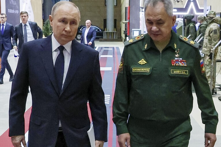 FILE - Russian President Vladimir Putin, left, and Russian Defense Minister Sergei Shoigu arrive for a meeting with the military brass in Moscow, Russia, Tuesday, Dec. 19, 2023. A Shoigu deputy was detained last month on charges of bribery amid reports of rampant corruption. (Mikhail Klimentyev, Sputnik, Kremlin Pool Photo via AP, File)