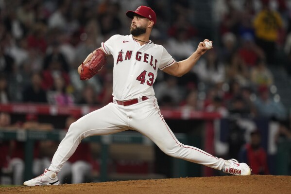 Los Angeles Angels starting pitcher Patrick Sandoval throws to the plate during the third inning of a baseball game against the Texas Rangers, Monday, Sept. 25, 2023, in Anaheim, Calif. (AP Photo/Ryan S. Sun)