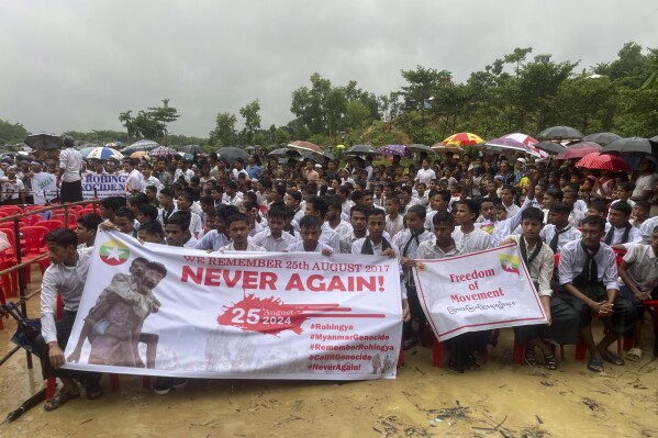 Hundreds of Rohingyas gather to demand safe return to Myanmar's Rakhine state as they mark the seventh anniversary of their exile from Myanmar at their refugee camp at Kutupalong in Cox's Bazar district, Bangladesh, Sunday, Aug. 25, 2024. (AP Photo/ Shafiqur Rahman)
