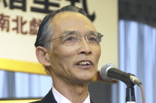 Japanese writer Seiichi Morimura delivers a speech in Tokyo in March 2010. Morimura, whose nonfiction trilogy "The Devil’s Gluttony" exposed human medical experiments conducted by a secret Japanese army unit during World War II, died Monday, July 24, 2023. He was 90. (Kyodo News via AP)