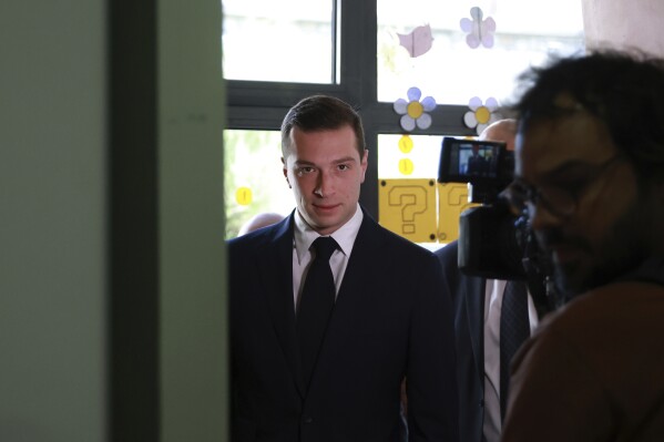 Far-right National Rally party president Jordan Bardella arrives to vote in Garches, outside Paris, Sunday, June 30, 2024. (AP Photo/Aurelien Morissard)