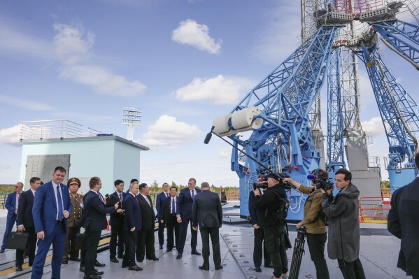 Russian President Vladimir Putin and North Korea's leader Kim Jong Un, seen center left, examine a launch pad of Soyuz rockets during their meeting at the Vostochny cosmodrome outside the city of Tsiolkovsky, about 200 kilometers (125 miles) from the city of Blagoveshchensk in the far eastern Amur region, Russia, on Wednesday, Sept. 13, 2023. (Mikhail Metzel, Sputnik, Kremlin Pool Photo via AP)