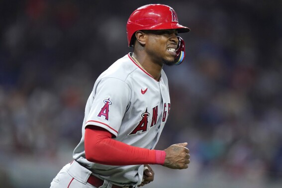FILE - Los Angeles Angels' Monte Harrison draws a walk during the team's baseball game against the Miami Marlins, July 6, 2022, in Miami. Arkansas has confirmed a report that Harrison, a 28-year-old outfielder who played parts of three seasons with the Angels and Marlins, plans to walk on with the Razorbacks’ football program. (AP Photo/Lynne Sladky, File)