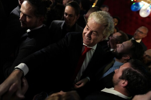 Geert Wilders, leader of the Party for Freedom, known as PVV, smiles after announcement of the first preliminary results of general elections in The Hague, Netherlands, Wednesday, Nov. 22, 2023. (AP Photo/Peter Dejong)