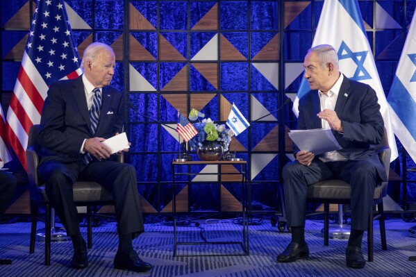 FILE - U.S. President Joe Biden, left, meets with Israeli Prime Minister Benjamin Netanyahu, right, to discuss the the war between Israel and Hamas, in Tel Aviv, Israel, on Oct. 18, 2023. The United States has offered strong support to Israel in its war against Hamas. But the allies ar increasingly at odds over what will happen to the Gaza Strip once the war winds down. (Miriam Alster/Pool Photo via AP)