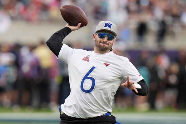 FILE - NFC quarterback Baker Mayfield, of the Tampa Bay Buccaneers, throws against the AFC during the flag football event at the NFL Pro Bowl football game Feb. 4, 2024, in Orlando, Fla. The NFL has taken another step in its commitment to growing flag football. The league hired Stephanie Kwok to a newly created position of vice president, head of flag football. (AP Photo/Chris O'Meara, File)