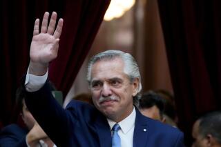 Argentine President Alberto Fernandez waves as he arrives to the opening session of Congress in Buenos Aires, Argentina, Wednesday, March 1, 2023. Fernandez announced on April 21, 2023 that he will not seek re-election in October elections. (AP Photo/Natacha Pisarenko)