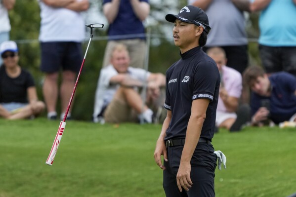 Australia's Min Woo Lee reacts after missing a birdie putt on the eighth green during the third round of the Australian Open Golf Championships at the Australian Golf Club in Sydney, Australia, Saturday, Dec. 2, 2023. (AP Photo/Mark Baker)