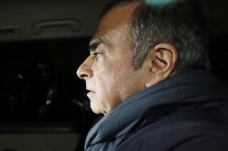 
              In this April 3, 2019 photo, former Nissan Chairman Carlos Ghosn in a car leaves his lawyer's office in Tokyo. Japanese prosecutors took Ghosn for questioning Thursday, April 4, 2019, barely a month after he was released on bail ahead of his trial on financial misconduct charges. (Takuya Inaba/Kyodo News via AP)
            
