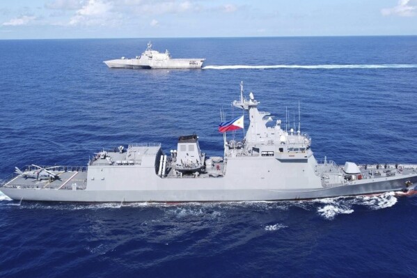 CORRECTS TO USS GABRIELLE GIFFORDS, FILE - In this handout photo released by Armed Forces of the Philippines, Philippines BRP Jose Rizal (FF150), right, and USS Gabrielle Giffords (LCS 10) during a tactical exercise between Philippines and the United States in the West Philippine Sea on Thursday Nov. 23, 2023. The Chinese military said on Dec. 4 that American naval ship USS Gabriel Giffords had 